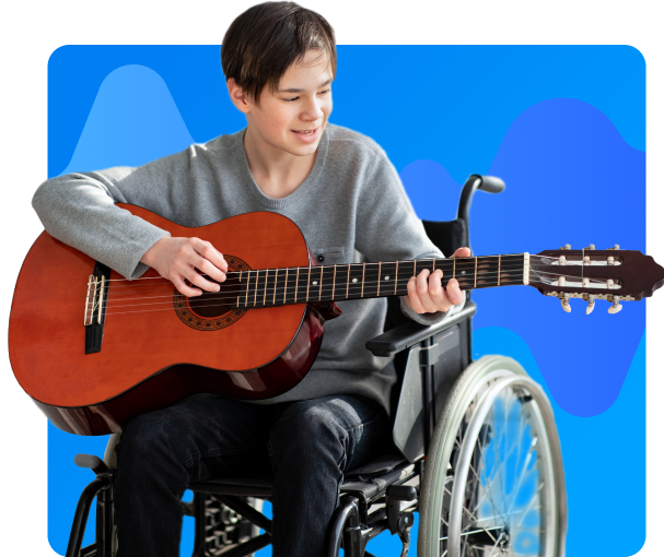 Boy in wheelchair playing guitar