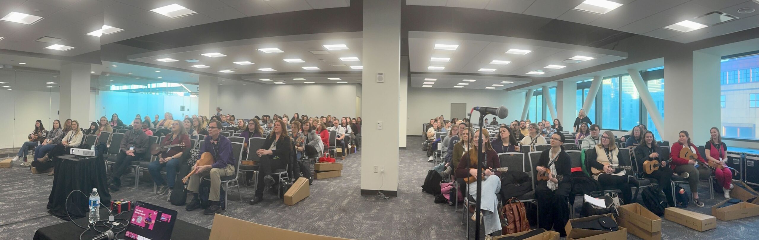 The Ohio Music Education Association (MEA) session room was filled with educators, learning ukulele through Music Will's modern band pedagogy. 
