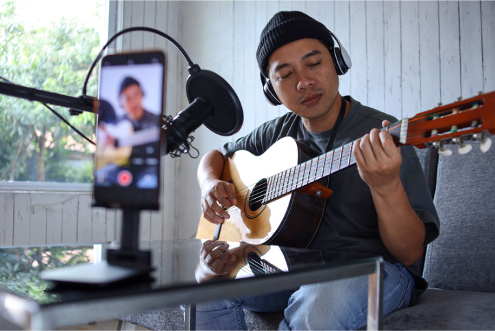 Student recording an original song for the National Student Songwriting Exhibition